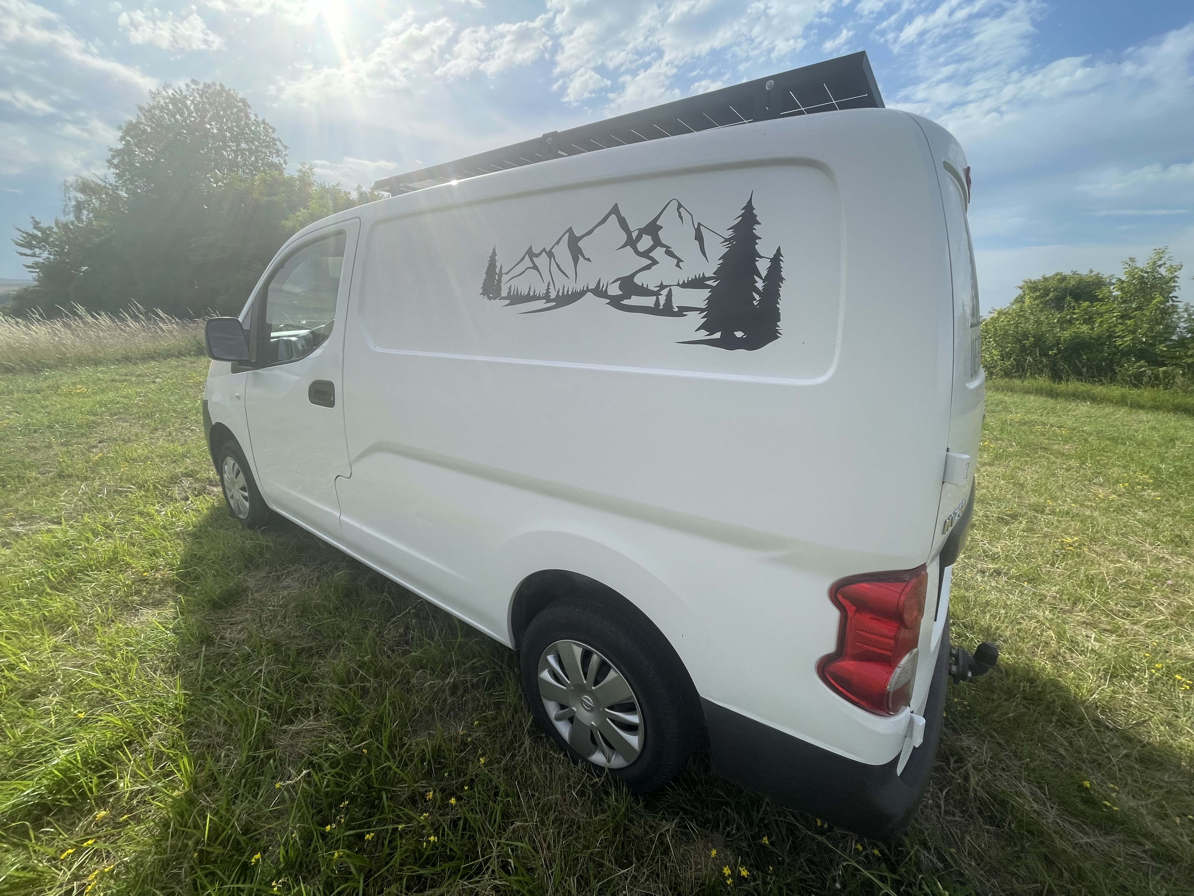 camping-car NISSAN NV200   extérieur / latéral gauche